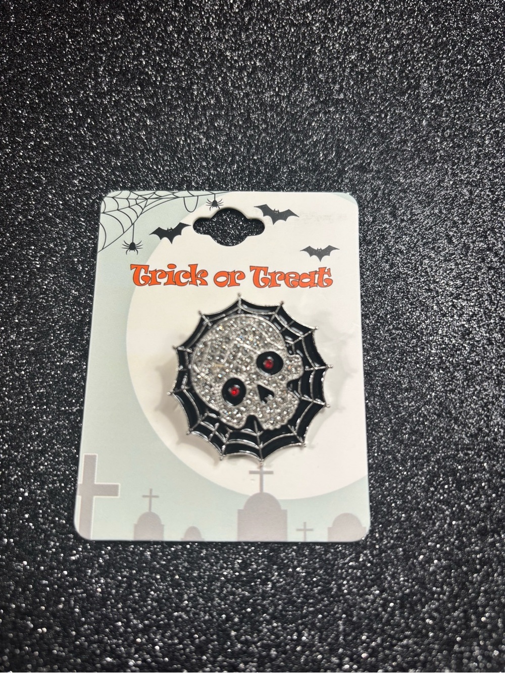 Skull Brooch with Black Web Accent